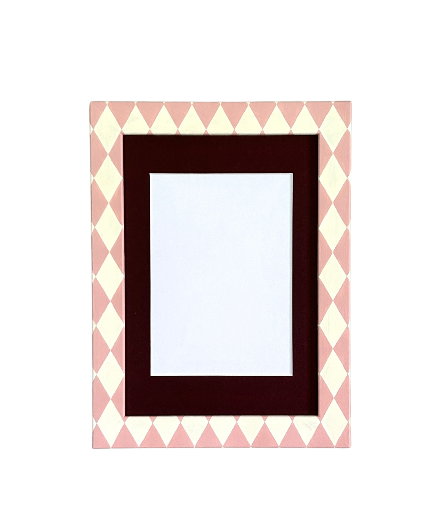 Rectangular picture frame with a pink and white chevron pattern border on a white background