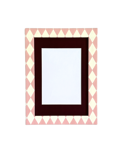 Rectangular picture frame with a pink and white chevron pattern border on a white background