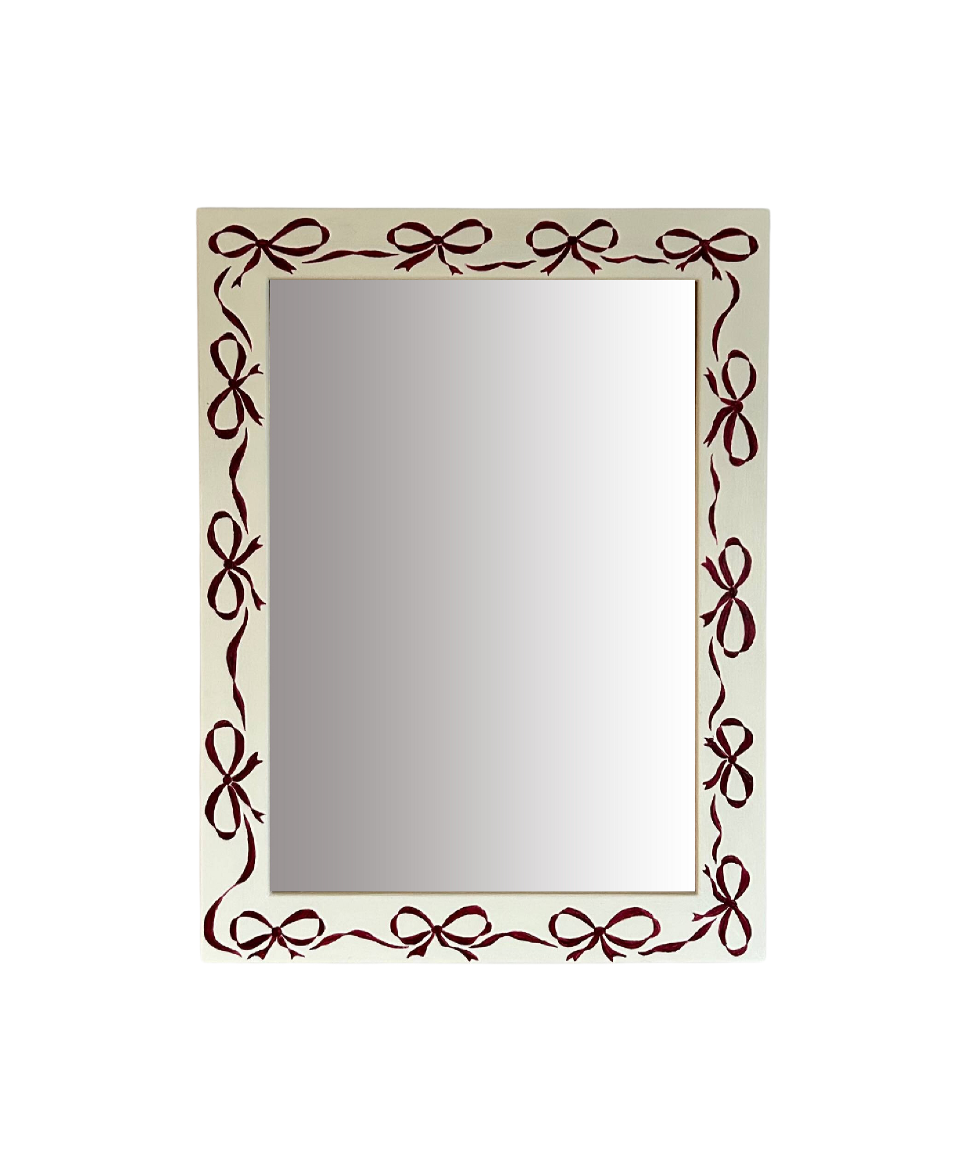 Rectangular mirror with decorative brown bow frame on a white background