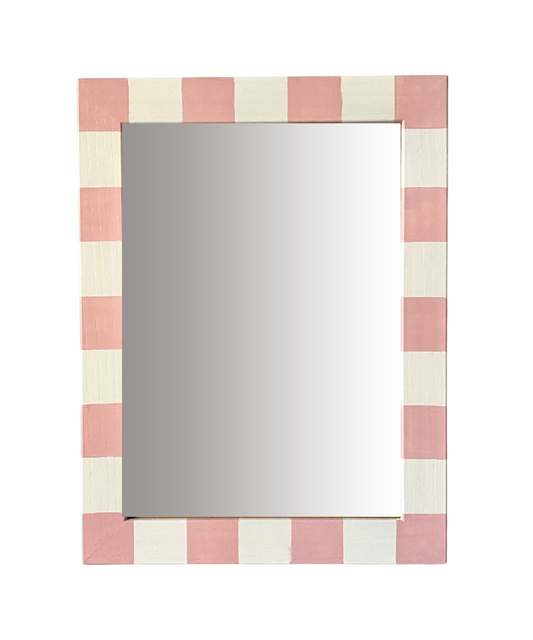 Rectangular mirror with a pink and white striped frame on a white background