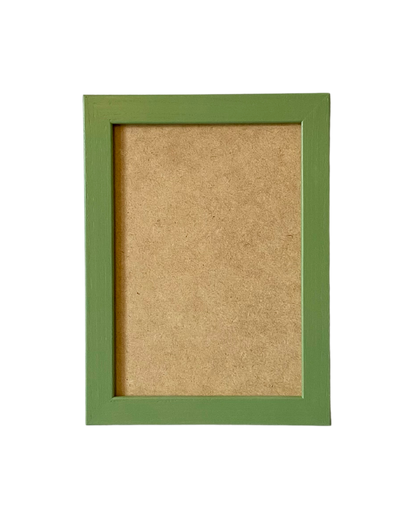 Green picture frame with a brown cardboard back on a white background