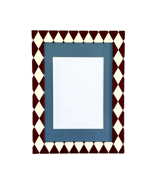 Decorative picture frame with a geometric pattern on a white background