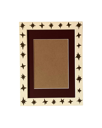 Decorative picture frame with star patterns on a white background