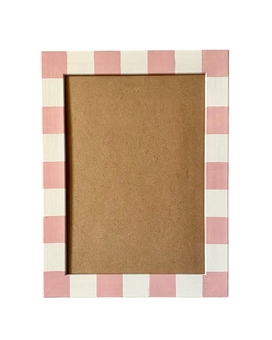 Rectangular photo frame with pink and white checkered border on a white background