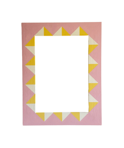 Rectangular picture frame with a geometric pattern on a pink background