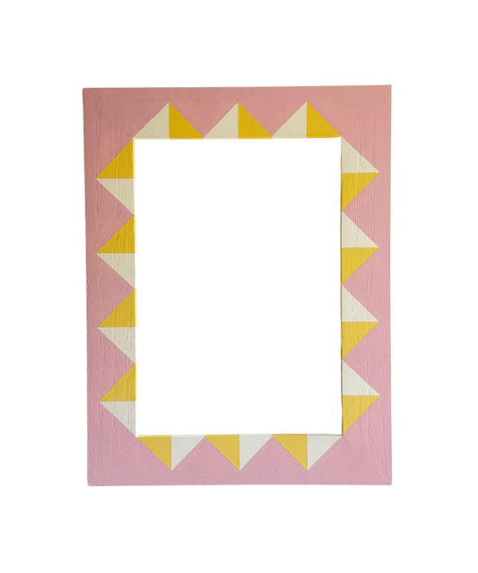 Rectangular picture frame with a geometric pattern on a pink background
